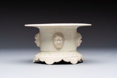 A Chinese qingbai censer with masks in relief, 20th C
