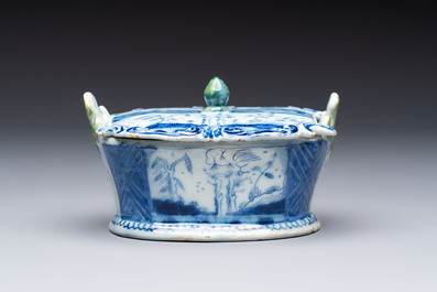 A blue and white Dutch Delft butter tub with green-glazed accents, 18th C.