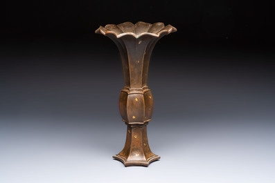 A Chinese gold-splashed bronze 'Gu' vase, Xuande mark, 17/18th C.