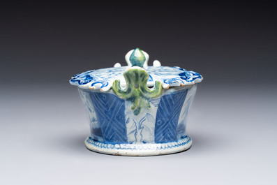 A blue and white Dutch Delft butter tub with green-glazed accents, 18th C.