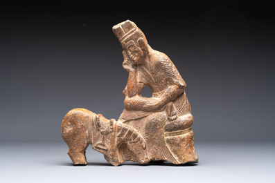 A Chinese sandstone 'Bai Ma Shi Zu 白馬舐足' carving, Northern Wei