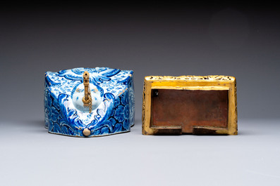 A large blue and white Dutch Delft 'Fountain of Youth' wall cistern with impressive reticulated gilt bronze cover, 18th C.