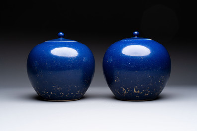 A pair of Chinese gilt-decorated powder-blue-ground covered jars and a famille rose powder-blue-ground jar, 18/19th C.