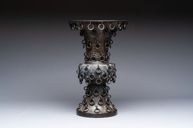 A Chinese archaistic bronze 'Zun' vase with 99 rings, 18/19th C.