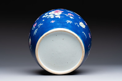 A pair of Chinese gilt-decorated powder-blue-ground covered jars and a famille rose powder-blue-ground jar, 18/19th C.