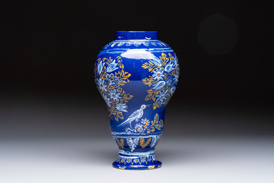 A Nevers blue-ground baluster vase with birds among flowering branches, France, 2nd half 17th C.