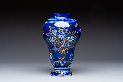 A Nevers blue-ground baluster vase with birds among flowering branches, France, 2nd half 17th C.