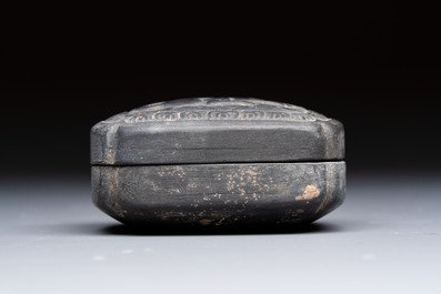 A Chinese carved black pottery 'Mythical Animal' box and cover, Yuan/Ming