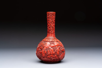 Two Chinese cinnabar lacquer covered boxes and a bottle vase, 19th C.