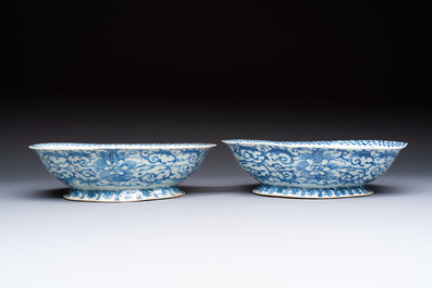 Four Chinese blue, white and famille rose tazzas and a covered spice bowl with bats design, 19th C.