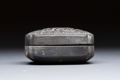 A Chinese carved black pottery 'Mythical Animal' box and cover, Yuan/Ming