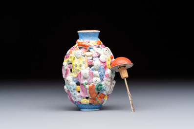 A Chinese famille rose moulded, reticulated and double-walled '18 Luohan' snuff bottle, Qianlong mark, 19th C.