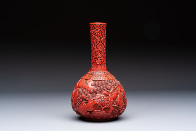 Two Chinese cinnabar lacquer covered boxes and a bottle vase, 19th C.