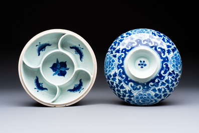 Four Chinese blue, white and famille rose tazzas and a covered spice bowl with bats design, 19th C.