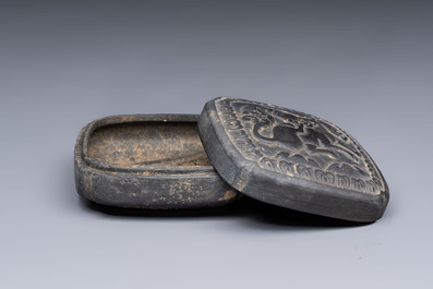 A Chinese carved black pottery 'Mythical Animal' box and cover, Yuan/Ming