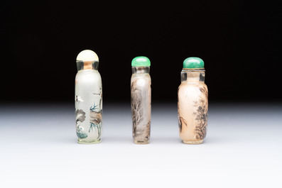 A Chinese rock crystal and two glass inside painted snuff bottles, 19/20th C., with a signed copy of 'Chinese Inside Painting of the Modern Age', 2005