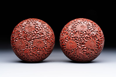 Two Chinese cinnabar lacquer covered boxes and a bottle vase, 19th C.