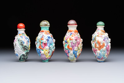 Four Chinese famille rose moulded 'Luohan' snuff bottles, Qianlong marks, 19th C.