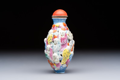 A Chinese famille rose moulded, reticulated and double-walled '18 Luohan' snuff bottle, Qianlong mark, 19th C.