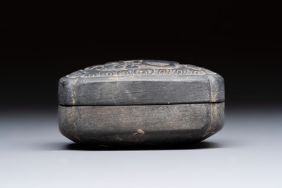 A Chinese carved black pottery 'Mythical Animal' box and cover, Yuan/Ming