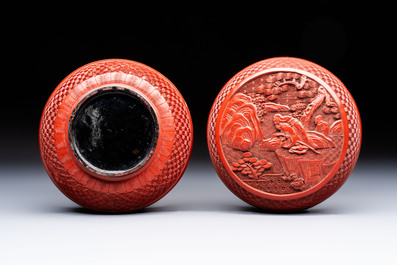 Two Chinese cinnabar lacquer covered boxes and a bottle vase, 19th C.