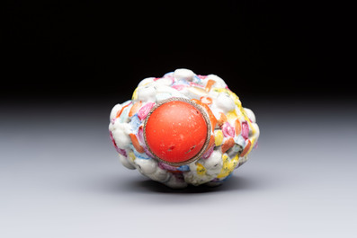 A Chinese famille rose moulded, reticulated and double-walled '18 Luohan' snuff bottle, Qianlong mark, 19th C.