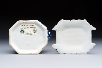 A blue and white Dutch Delft chinoiserie butter tub with a reclining figure finial, 18th C.