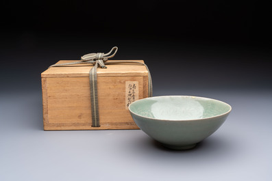 A fine Korean celadon moulded 'Peony Scroll' bowl with a wooden box, Goryeo, 13th C.