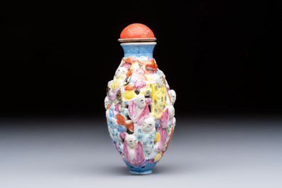 A Chinese famille rose moulded, reticulated and double-walled '18 Luohan' snuff bottle, Qianlong mark, 19th C.