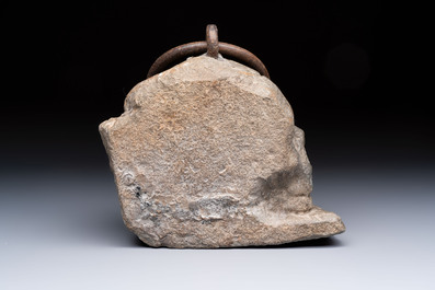 An Italian carved Serena stone 'Memento Mori' in the form of a skull with a wrought-iron suspension ring, probably Tuscany, 17th C.