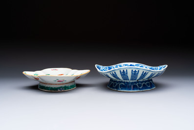 Four Chinese blue, white and famille rose tazzas and a covered spice bowl with bats design, 19th C.