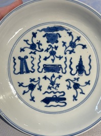 A Chinese blue and white 'Buddhist Symbols' plate, Chenghua mark, Kangxi