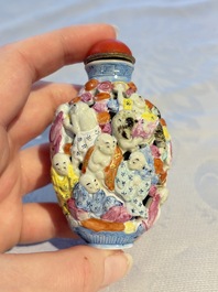 A Chinese famille rose moulded, reticulated and double-walled '18 Luohan' snuff bottle, Qianlong mark, 19th C.