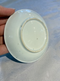 A pair of Chinese famille rose 'Taming the Tiger' saucers, Yongzheng