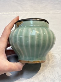 A Chinese Longquan celadon 'Lotus' jar with bronze mount, Song