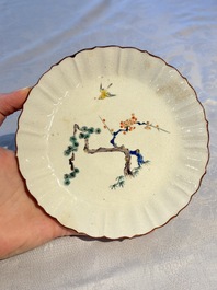A Japanese Kakiemon-style 'Three Friends of Winter' plate, Edo, late 17/18th C.