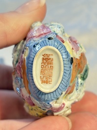 A Chinese famille rose moulded, reticulated and double-walled '18 Luohan' snuff bottle, Qianlong mark, 19th C.