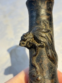 A small Chinese bronze vase with a chilong on a wooden stand, Yuan