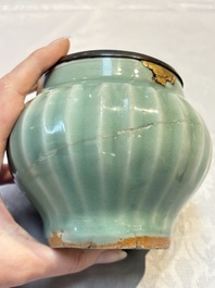 A Chinese Longquan celadon 'Lotus' jar with bronze mount, Song
