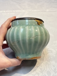 A Chinese Longquan celadon 'Lotus' jar with bronze mount, Song