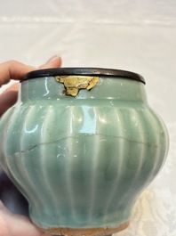 A Chinese Longquan celadon 'Lotus' jar with bronze mount, Song