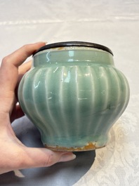 A Chinese Longquan celadon 'Lotus' jar with bronze mount, Song