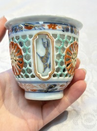 A rare Chinese famille verte reticulated double-walled cup and saucer, artemisia leaf mark, Kangxi