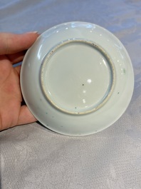 A pair of Chinese famille rose 'Taming the Tiger' saucers, Yongzheng