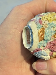 Four Chinese famille rose moulded 'Luohan' snuff bottles, Qianlong marks, 19th C.
