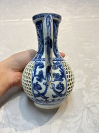 A rare Chinese blue and white reticulated double-walled ewer and cover with floral design, Kangxi