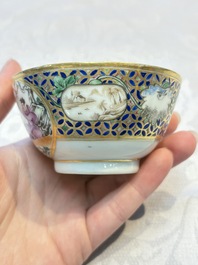 A Chinese famille rose gilt-decorated cup and saucer with figural design, Jiaqing