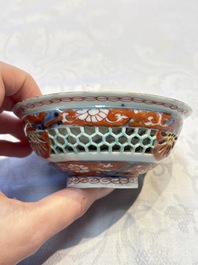 A rare Chinese famille verte reticulated double-walled cup and saucer, artemisia leaf mark, Kangxi