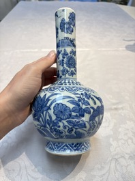 A Chinese blue and white bottle vase with floral design, hare mark, Wanli