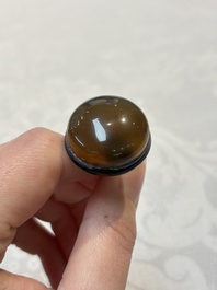 A very large Chinese brown-overlay amber glass 'Ba Xian Zhu Shou 八仙祝壽&lsquo; table snuff bottle, 19th C.